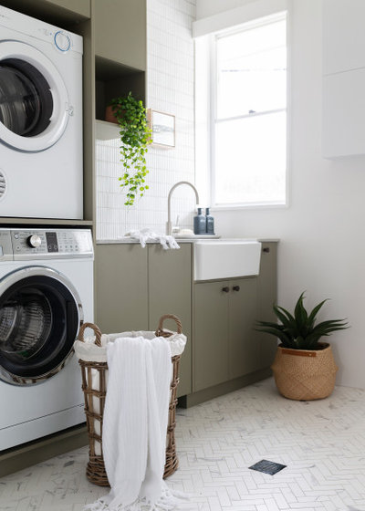Transitional Laundry Room by Studio Black Interiors
