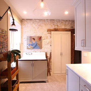 Pale Green Cabinets with Exposed Stone Wall and Timber Door Jamb