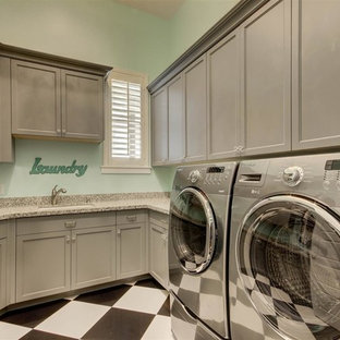 Inspiration for a mid-sized transitional u-shaped ceramic tile and multicolored floor laundry closet remodel in Phoenix with an undermount sink, recessed-panel cabinets, gray cabinets, granite countertops, blue walls, a side-by-side washer/dryer and gray countertops