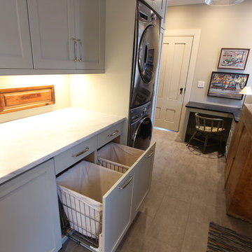 Sea Grass Painted Cabinets with Pull Out Hamper Storage