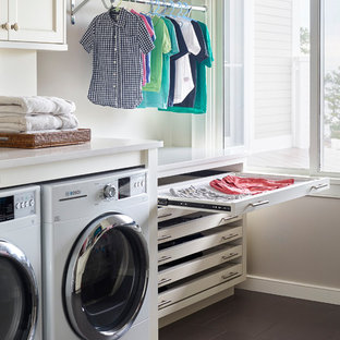 Dedicated laundry room - coastal gray floor dedicated laundry room idea in Boston with white cabinets, gray walls, a side-by-side washer/dryer, white countertops and shaker cabinets