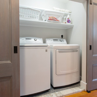 Inspiration for a small contemporary single-wall ceramic tile laundry closet remodel in Boston with white walls and a side-by-side washer/dryer