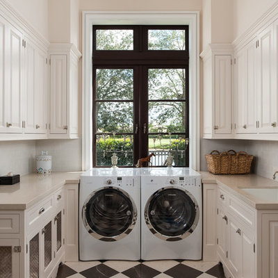 Elegant multicolored floor laundry room photo in Other with white cabinets, white walls and beige countertops