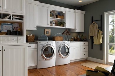 Huge elegant galley vinyl floor utility room photo in Other with a drop-in sink, white cabinets, granite countertops, gray walls, a side-by-side washer/dryer and recessed-panel cabinets