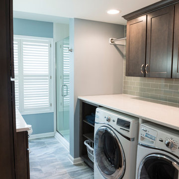 Traditional Laundry Room with Porcelain Floor Tile and Dark Wood Cabinets