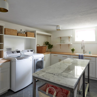Large farmhouse l-shaped slate floor and gray floor laundry room photo in Other with a drop-in sink, shaker cabinets, white cabinets, white walls and a side-by-side washer/dryer