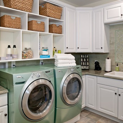 Inspiration for a timeless laundry room remodel in New York with white cabinets, a side-by-side washer/dryer, beige countertops and gray walls