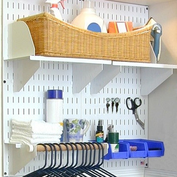 Wall Control metal pegboard being used for laundry room storage and organization