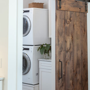 Inspiration for a mid-sized transitional single-wall dedicated laundry room remodel in Other with beaded inset cabinets, white cabinets and marble countertops