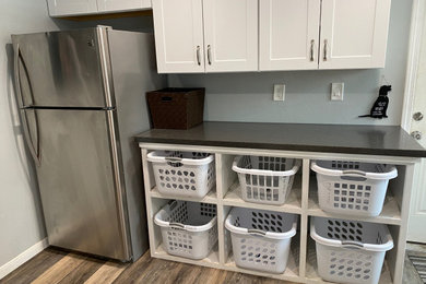 Inspiration for a contemporary laundry room remodel in Houston