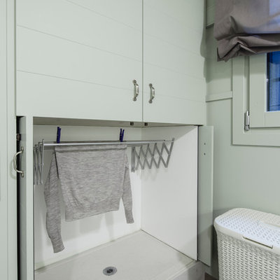 Example of a small transitional utility room design in Barcelona with flat-panel cabinets