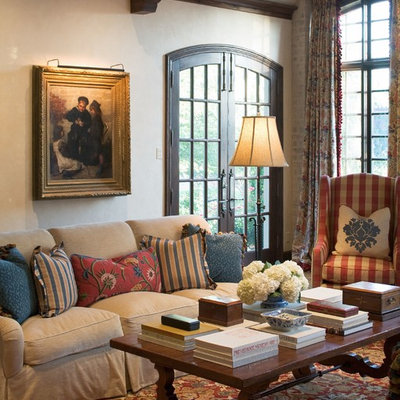Tuscan enclosed living room photo in Wichita with beige walls