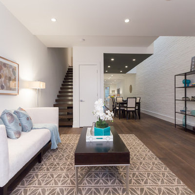 Trendy open concept living room photo in DC Metro with white walls