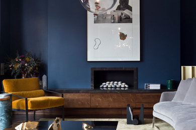 Inspiration for a contemporary formal living room in London with blue walls and a ribbon fireplace.