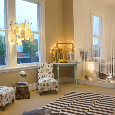 Example of an eclectic living room design in Other with beige walls