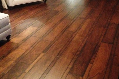 Example of a large transitional medium tone wood floor living room design in Austin