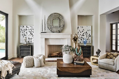 Tuscan open concept dark wood floor and brown floor living room photo in Austin with white walls and a standard fireplace