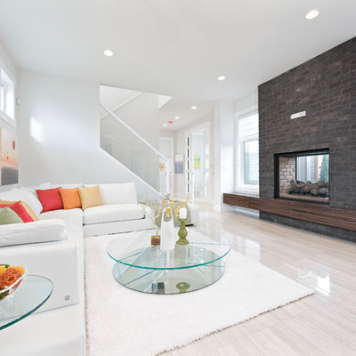 Living room - large contemporary living room idea in Calgary with white walls and a two-sided fireplace