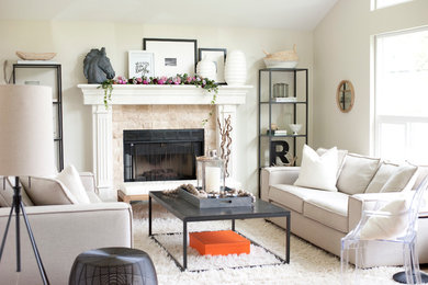 Eclectic living room photo in Vancouver with white walls and a standard fireplace