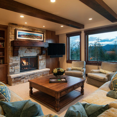 Living room - rustic carpeted living room idea in Salt Lake City with beige walls, a standard fireplace and a stone fireplace