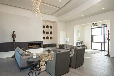 Living room - huge contemporary open concept and formal porcelain tile living room idea in Austin with white walls, a ribbon fireplace, a tile fireplace and no tv