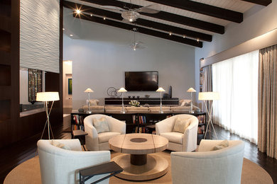Example of a large trendy open concept dark wood floor living room design in Phoenix with gray walls, a wall-mounted tv and a bar