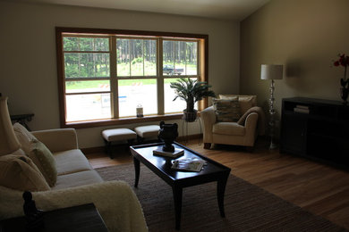 Inspiration for a large transitional open concept medium tone wood floor living room remodel in Other