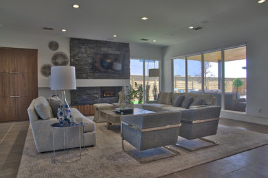 Example of a transitional open concept living room design in Other with a hanging fireplace, a stone fireplace and a wall-mounted tv