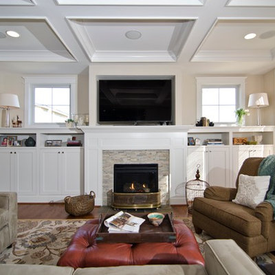 Example of a classic living room design in DC Metro with beige walls, a standard fireplace and a tile fireplace