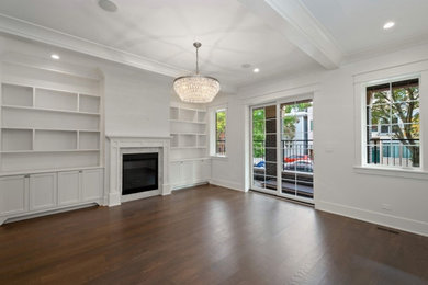 Inspiration for a transitional dark wood floor and brown floor living room library remodel in Chicago with white walls, a standard fireplace, a stone fireplace and no tv