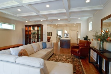 Medium tone wood floor living room photo in Chicago with beige walls