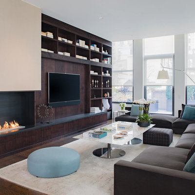 Living room - large contemporary open concept medium tone wood floor and brown floor living room idea in New York with white walls, a corner fireplace, a metal fireplace and a media wall
