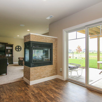 3 sided fireplace leading to family room