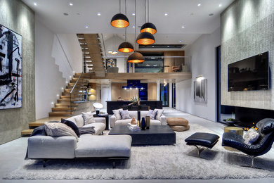 Photo of an expansive contemporary open plan living room in Orange County with a wall mounted tv.