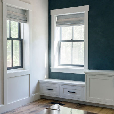 Example of a large cottage medium tone wood floor living room design in Boston