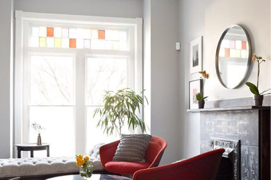 На фото: парадная, изолированная гостиная комната среднего размера в стиле модернизм с серыми стенами, темным паркетным полом, фасадом камина из камня и коричневым полом без телевизора