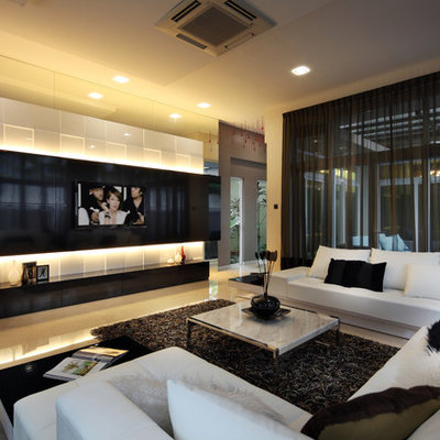 Inspiration for a contemporary living room remodel in Singapore with a media wall