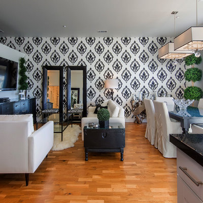 Example of a trendy medium tone wood floor living room design in Denver with multicolored walls and a wall-mounted tv