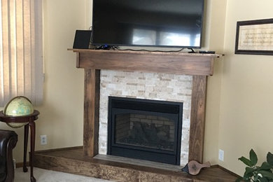 Inspiration for a living room remodel in Other with a corner fireplace