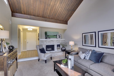 Example of a mid-sized classic formal and open concept carpeted living room design in Minneapolis with white walls, a standard fireplace, a stone fireplace and no tv