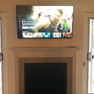 65" tv mount on drywall covered stone fireplace surround sound