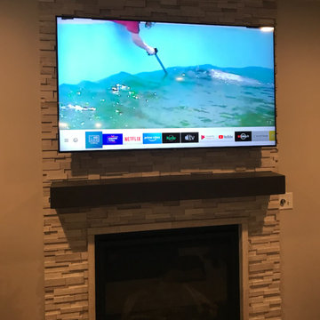 65" tv mount over stone fireplace