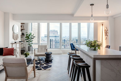 Example of a mid-sized danish open concept light wood floor and white floor living room design in New York with white walls and no fireplace
