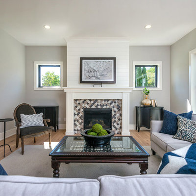 Living room - cottage living room idea in Minneapolis with a standard fireplace and a tile fireplace