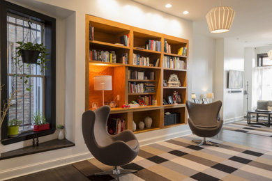 Inspiration for a small contemporary enclosed dark wood floor and brown floor living room library remodel in Chicago with white walls and no fireplace