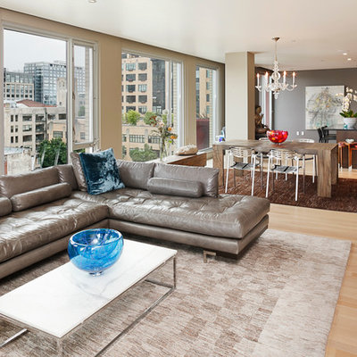 Example of a trendy open concept living room design in Portland with gray walls
