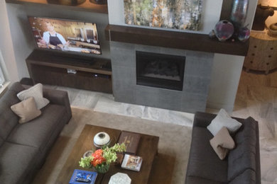 Inspiration for a mid-sized contemporary open concept ceramic tile living room remodel in Denver with gray walls, a standard fireplace, a stone fireplace and a wall-mounted tv