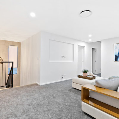 Example of a living room design in Brisbane with a media wall