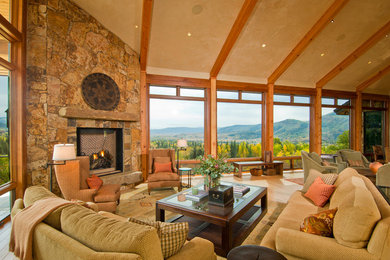 Trendy living room photo in Denver with a corner fireplace and a stone fireplace