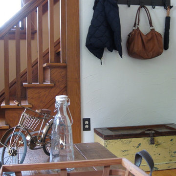 A corner serves as a drop zone, complete with an antique trunk for shoe storage.